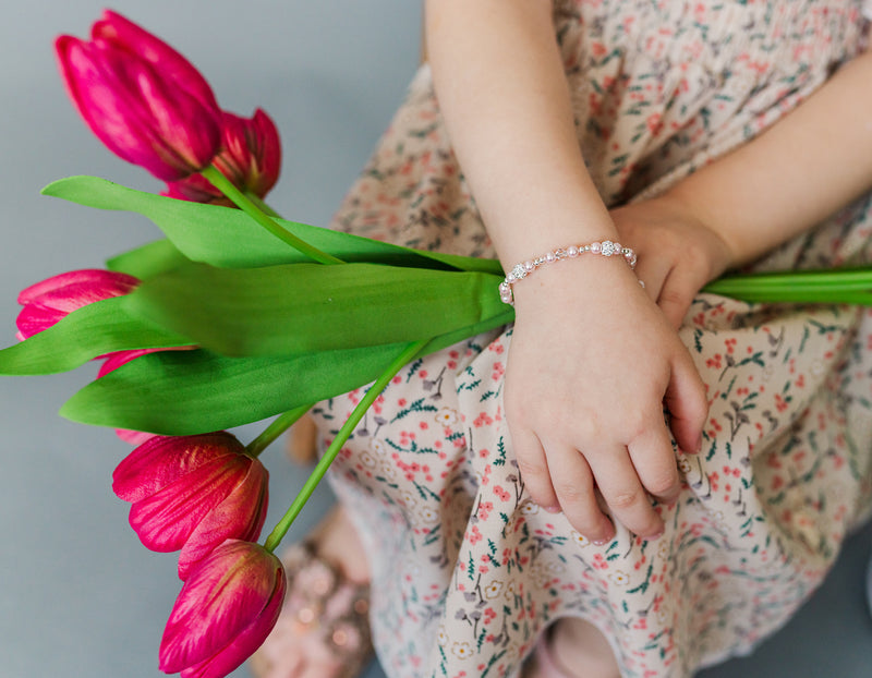 hands wearing Sterling Silver Pink Butterfly Bracelet