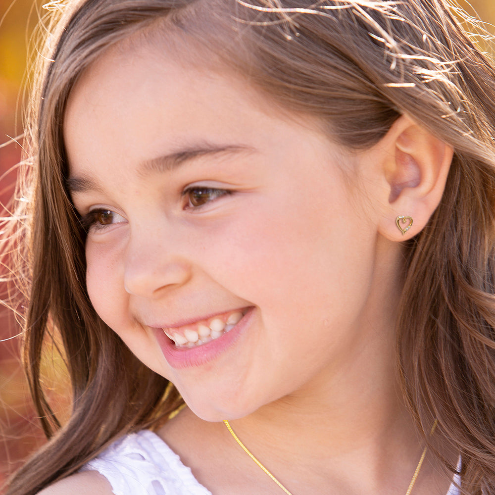 girl wearing 14K Gold-Plated Heart (Open) Earrings for Babies and Kids